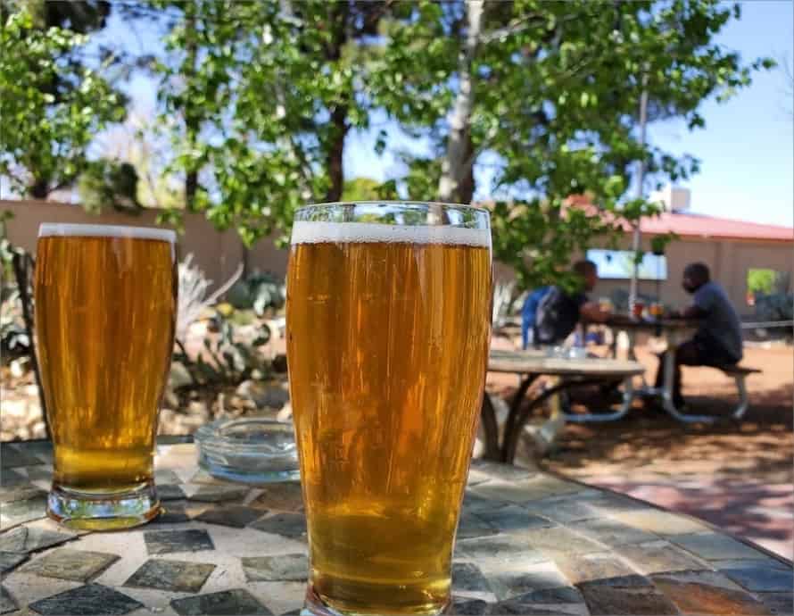 Two glasses of beer on a table outside at a brewery in Las Cruces.
