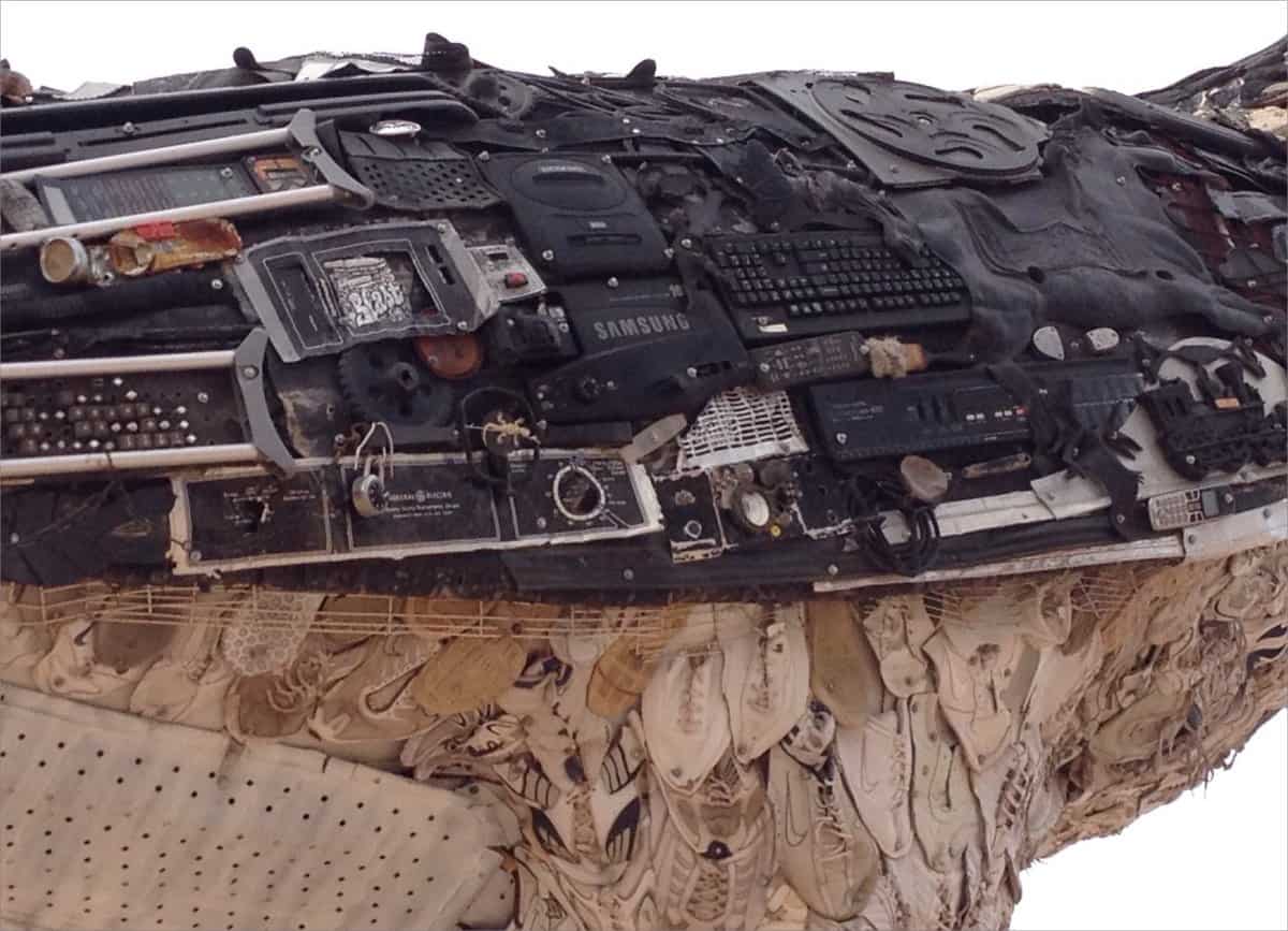 A unique sculpture of a roadrunner made out of computer parts and other recycled materials